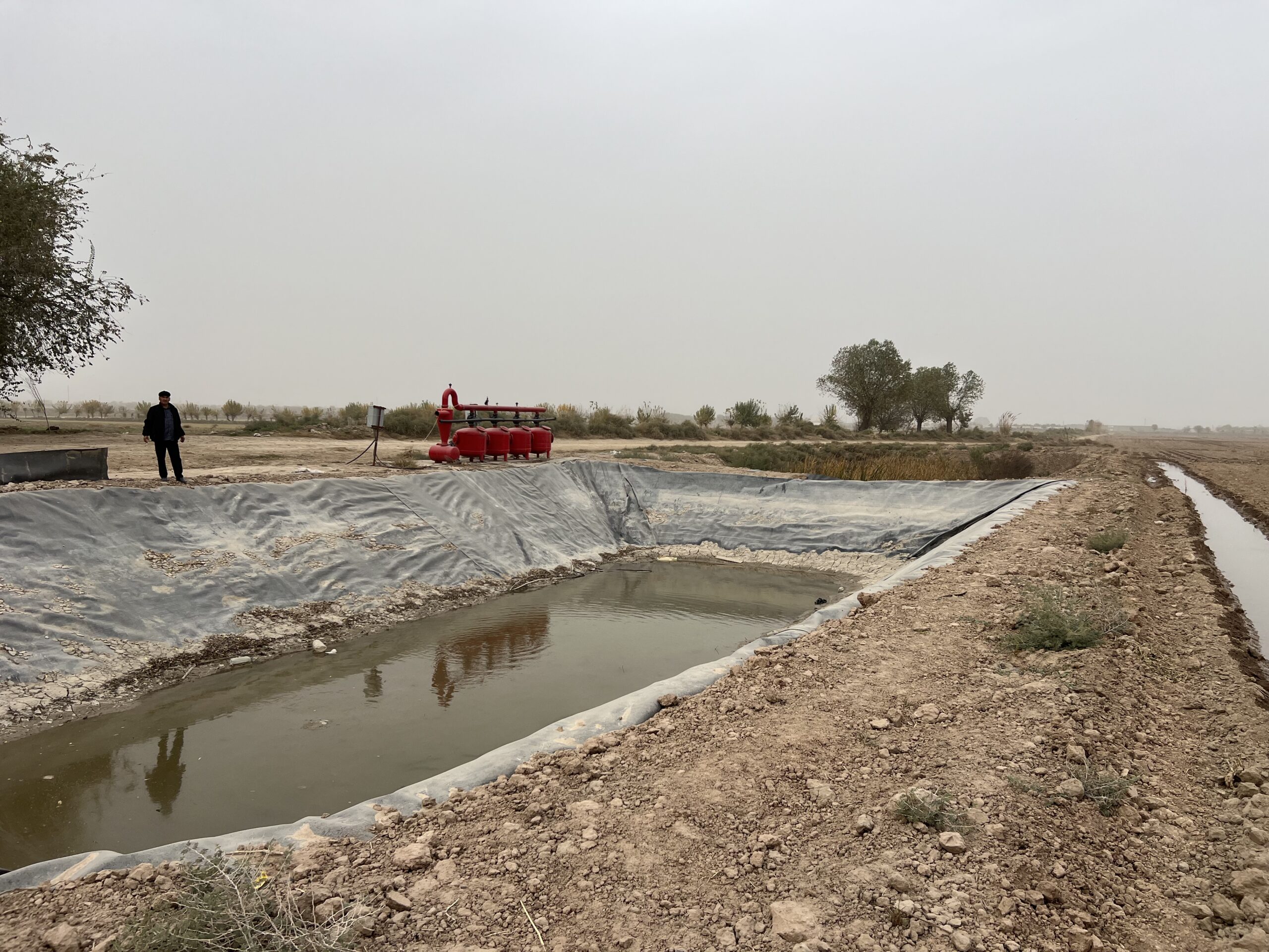 Accumulation pond for drip irrigation in one of the farms in Surkhandarya province. Photo by CABAR.asia